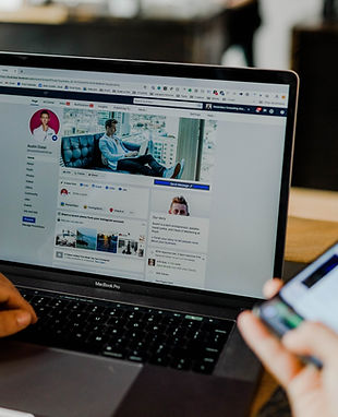 Designers crafting customised ad creatives with unique visuals and tailored messaging for targeted campaigns.